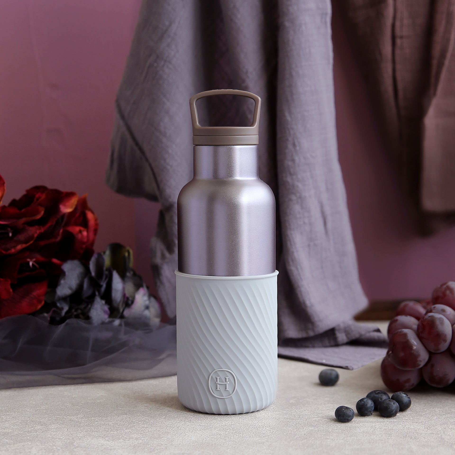 HYDY dusk violet and cloudy grey 16 oz bottle, showcasing the sleek design and color gradient of the reusable bottle.