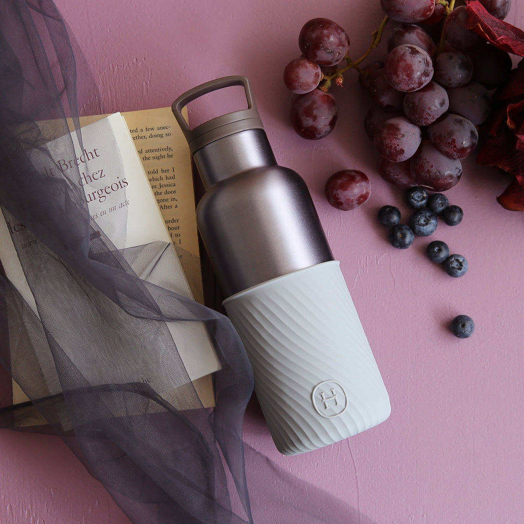 HYDY dusk violet and cloudy grey 16 oz bottle with a sleek, modern design and transparent body showing the liquid inside.