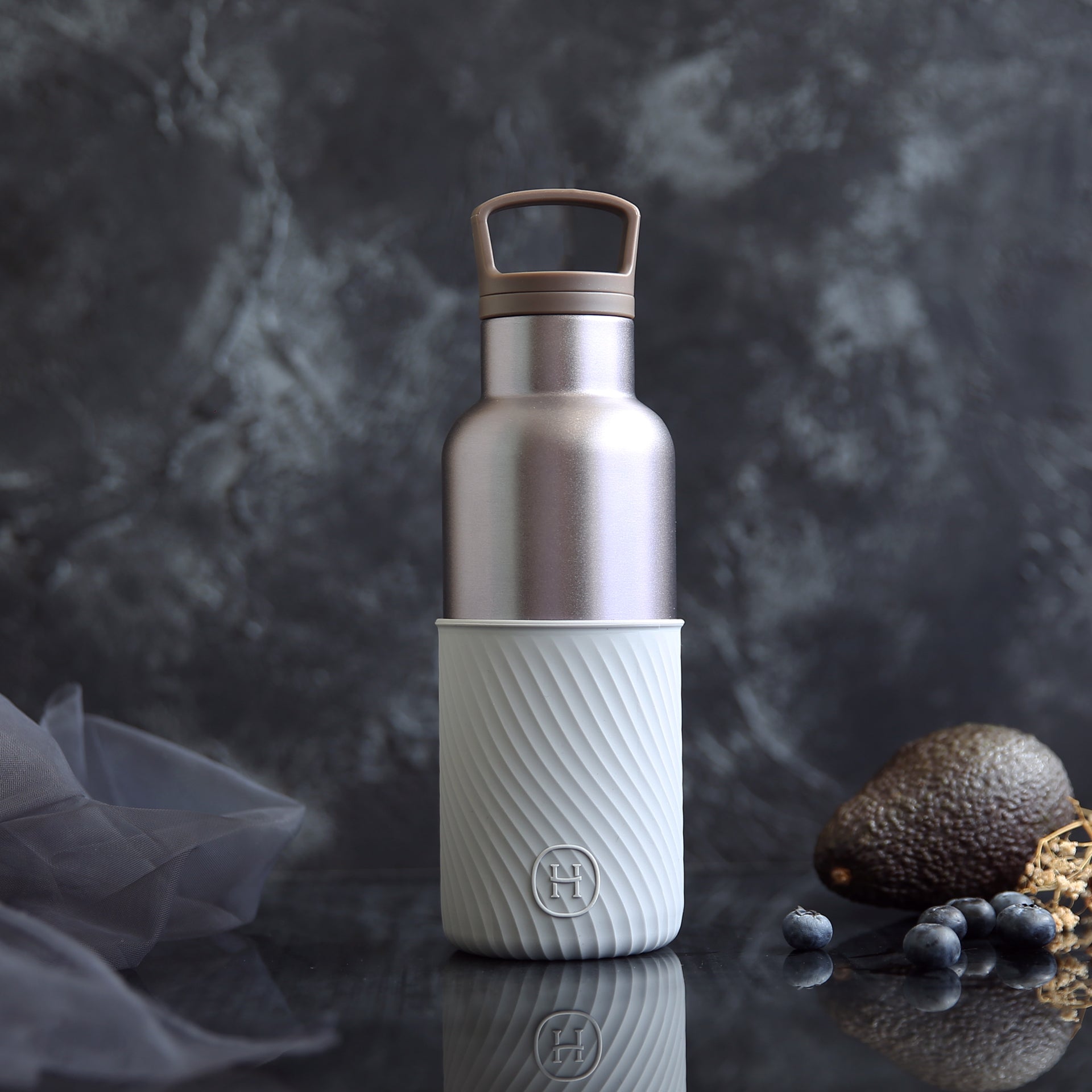HYDY Dusk Violet and Cloudy Grey 16 oz bottle with a sleek, modern design and vibrant color accents.