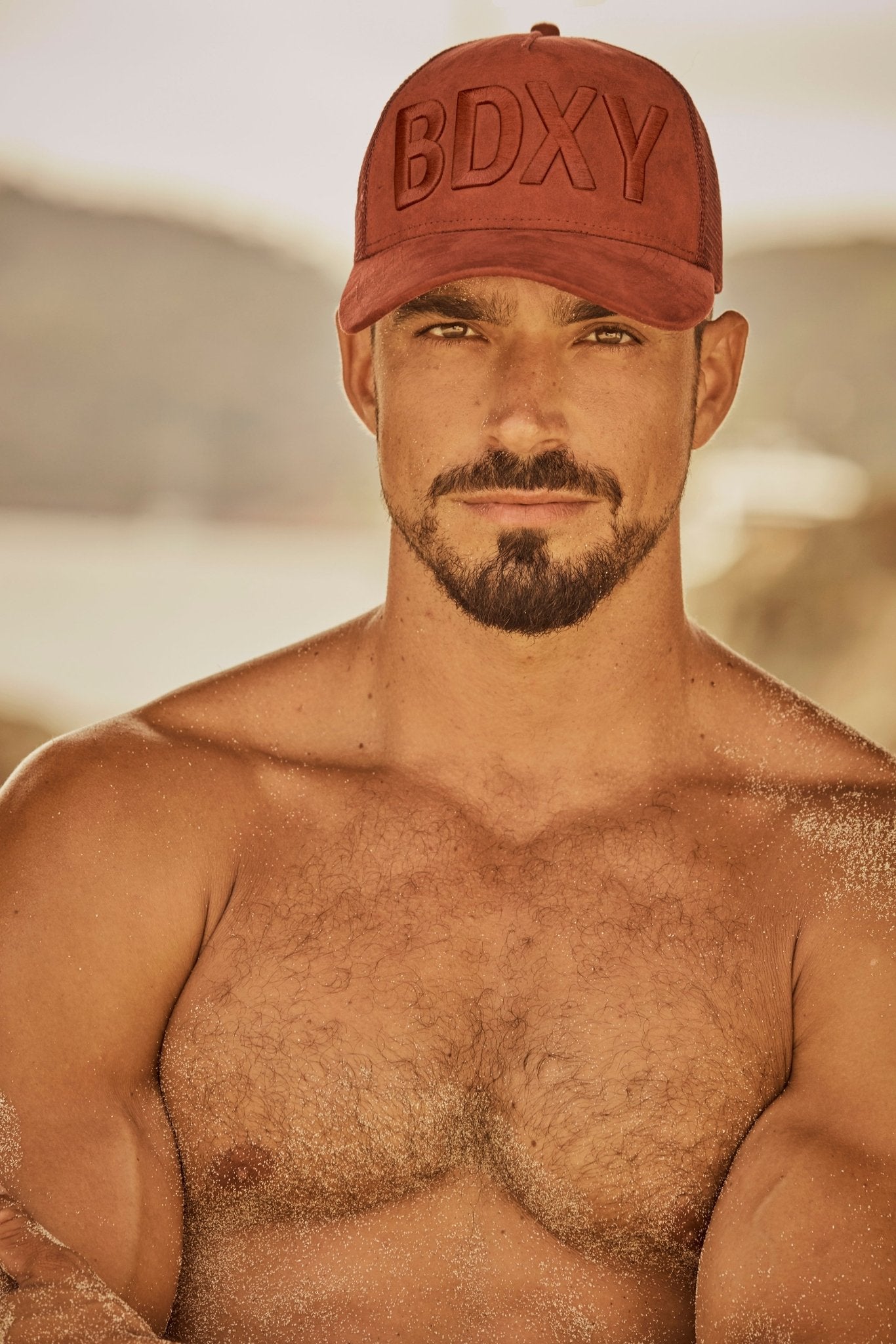 Burgundy "The Gaffer" trucker cap by BDXY Studios featuring mesh back and adjustable strap, casual streetwear style.