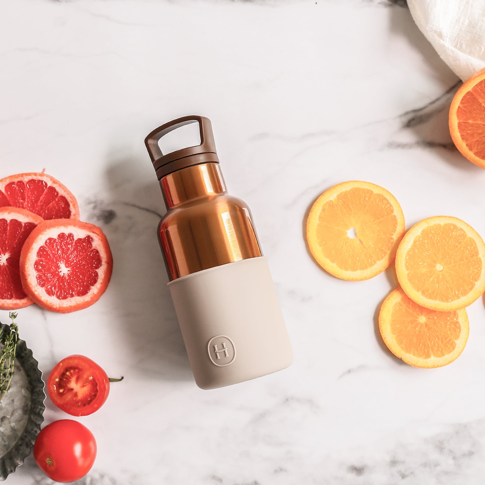 Bronze gold eucalyptus-scented 12 oz bottle from HYDY, featuring a sleek design and natural eucalyptus imagery.