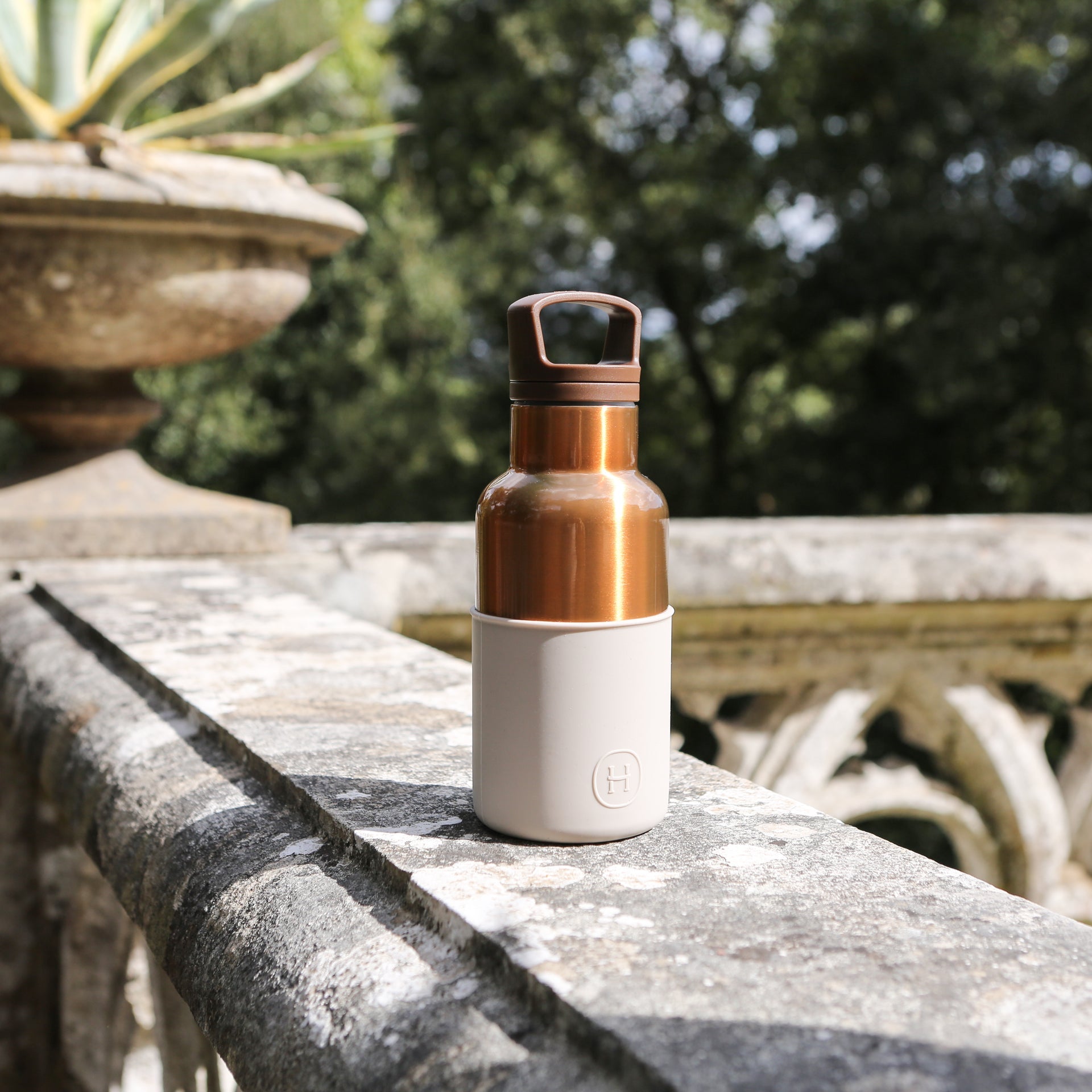 Bronze and gold-colored HYDY eucalyptus bottle, 12 oz, with a sleek design and natural eucalyptus imagery.