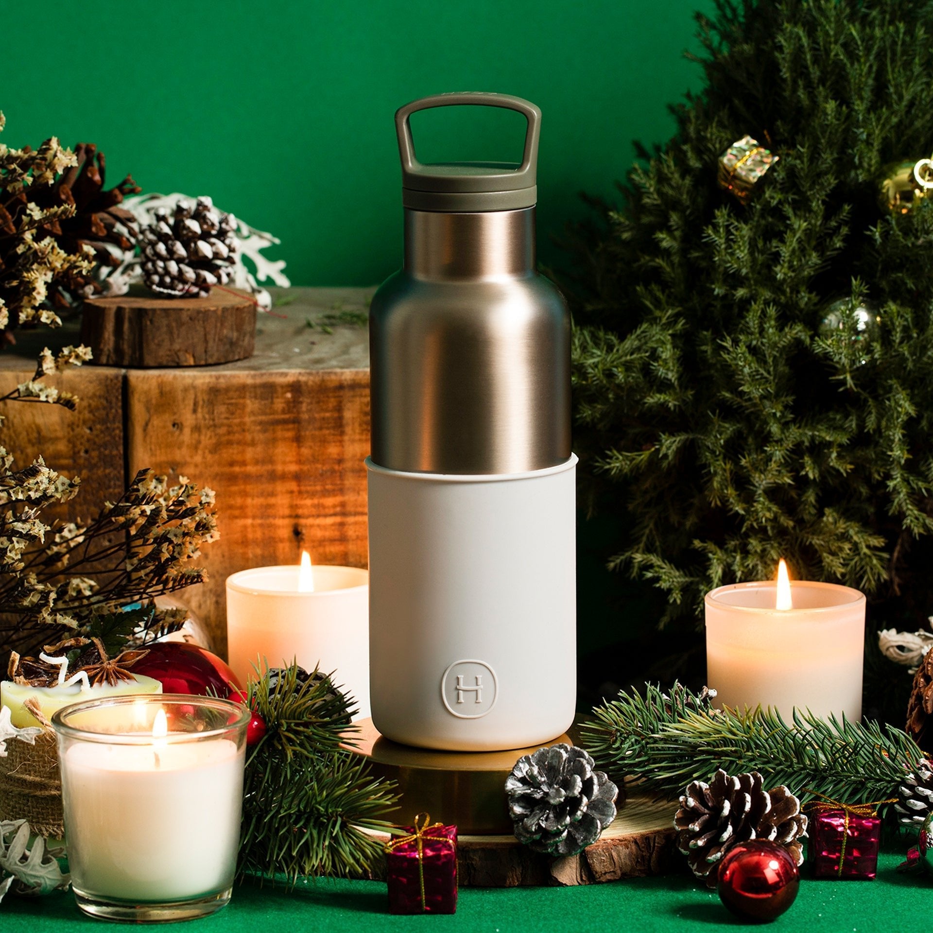 HYDY Metallic Fir-Cloudy Grey 16 Oz bottle with a sleek, metallic grey finish on smooth glass surface.