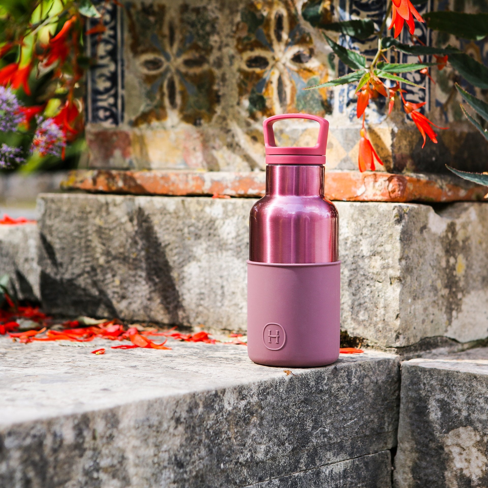 HYDY Rose Gold Dust in a 12 oz bottle, showcasing the shimmering dusty rose color and metal bottle design.