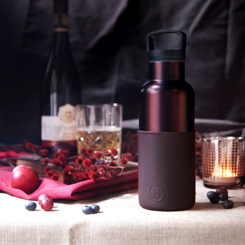 Burgundy-Black Cherry HYDY 16 oz bottle with a sleek label and clear glass showing the cherry-flavored beverage inside.