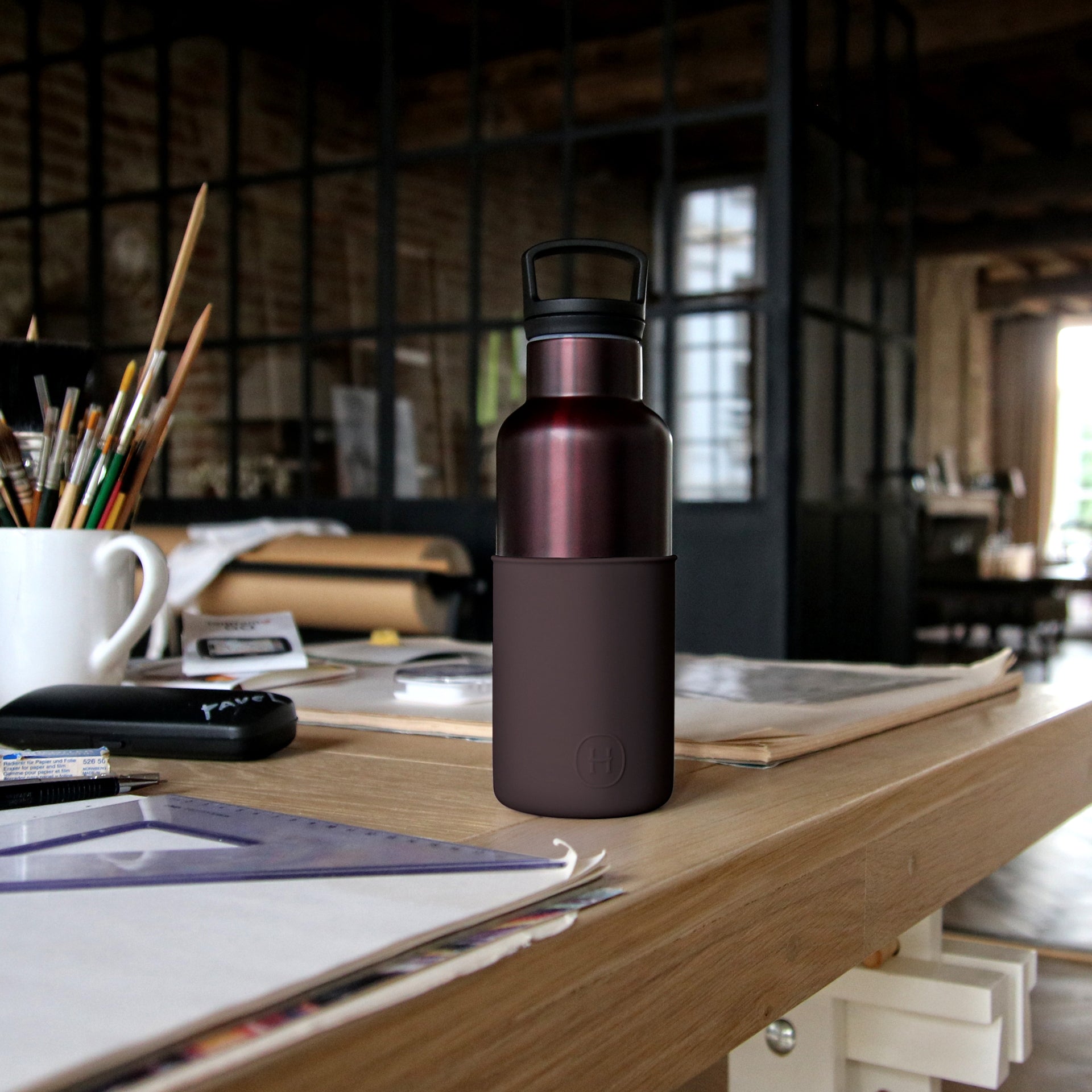 HYDY Burgundy-Black Cherry 16 oz bottle, glass container with a dark cherry-colored liquid and black accents, showcasing the product.