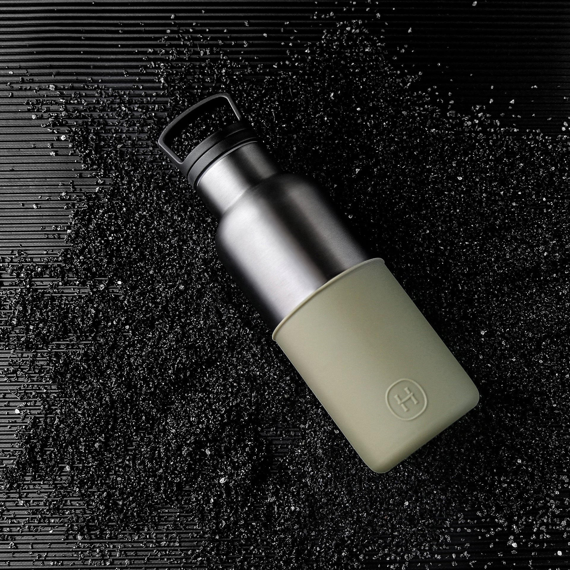 Titanium grey and army green HYDY 16 oz bottle with a sleek design and secure lid, ideal for hydration and outdoor use.