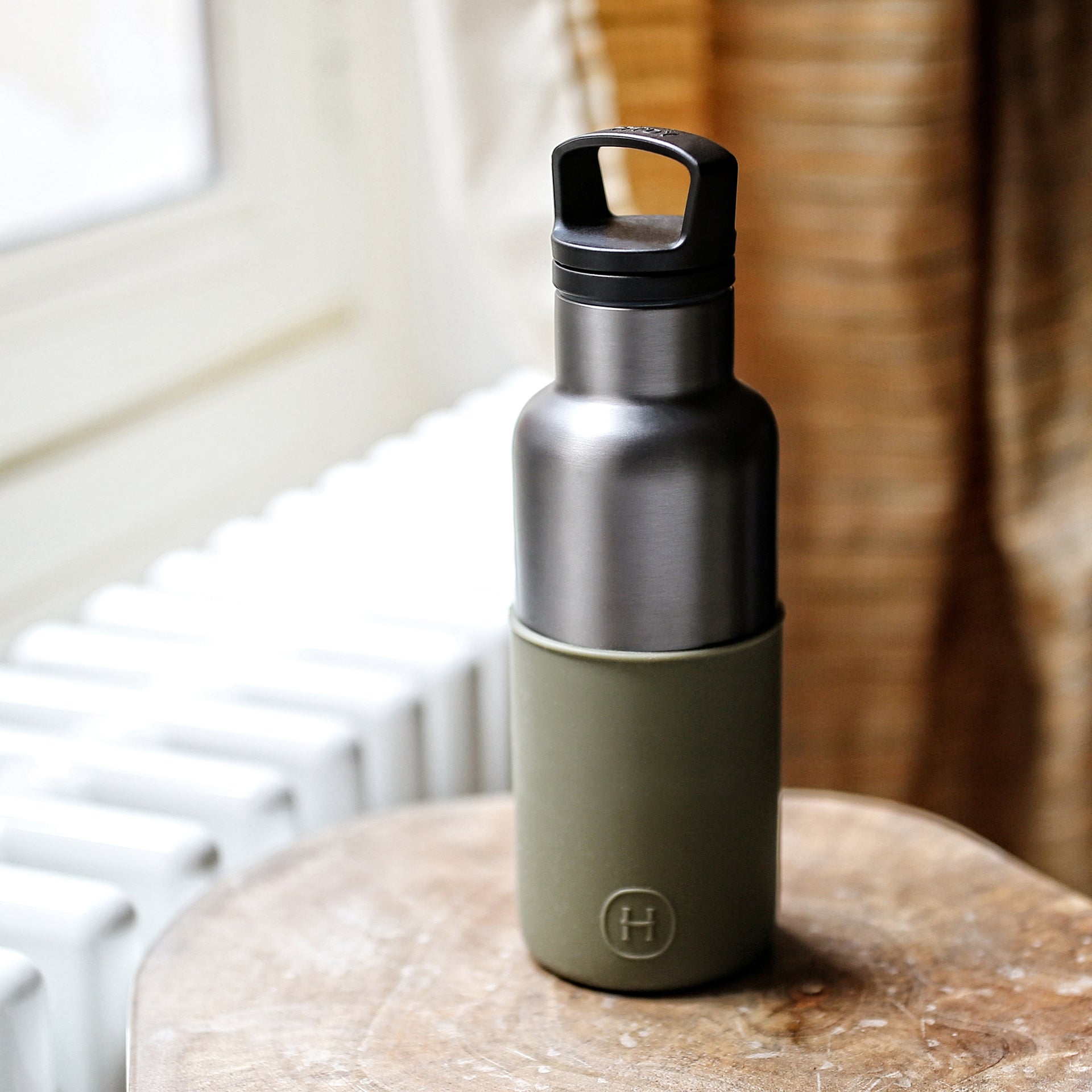 Titanium grey and Army Green 16 oz HYDY water bottle with a sleek, durable design and secure lid.