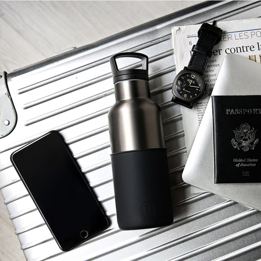 Hydy 16 oz titanium grey ink black bottle with a secure cap, showcasing the sleek design and durable plastic construction.