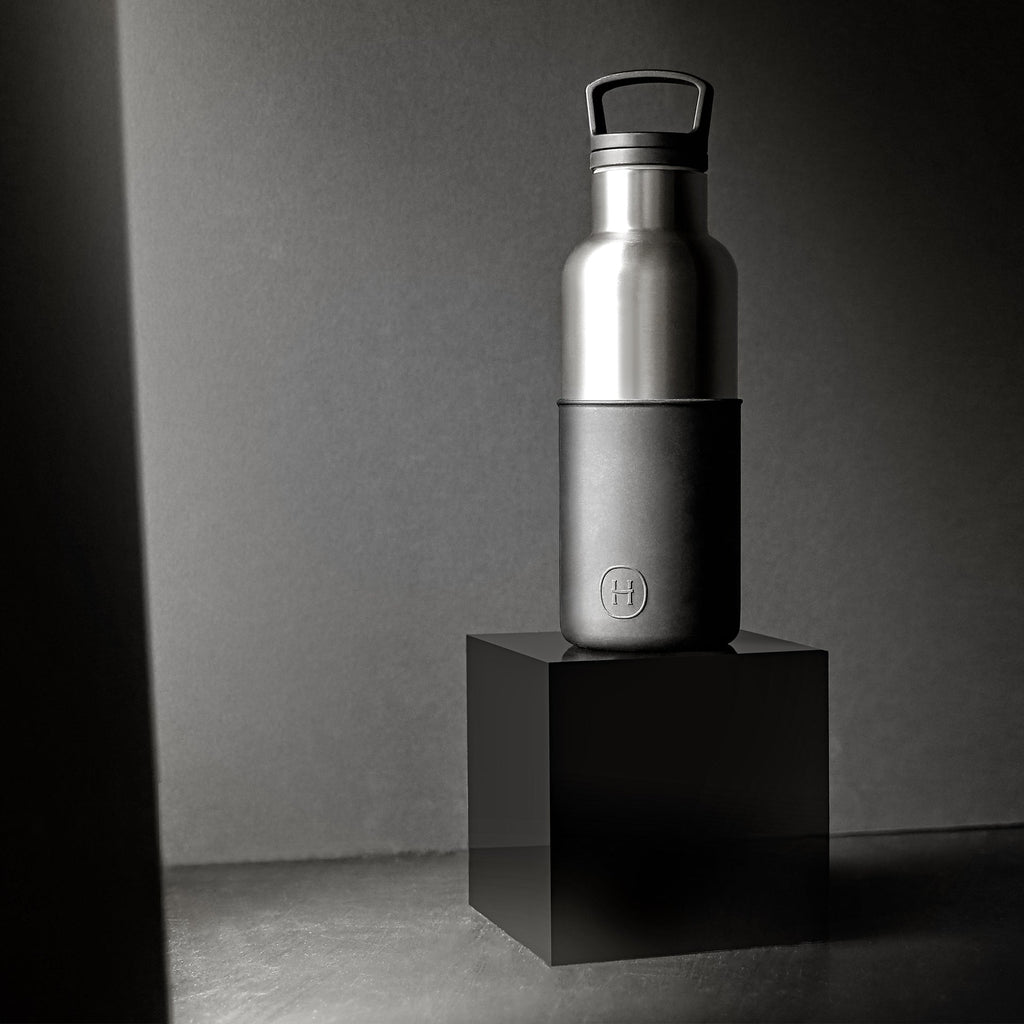 HYDY titanium grey ink black 16 oz bottle, showing the sleek container with label and screw-top lid, used for artistic or industrial purposes.