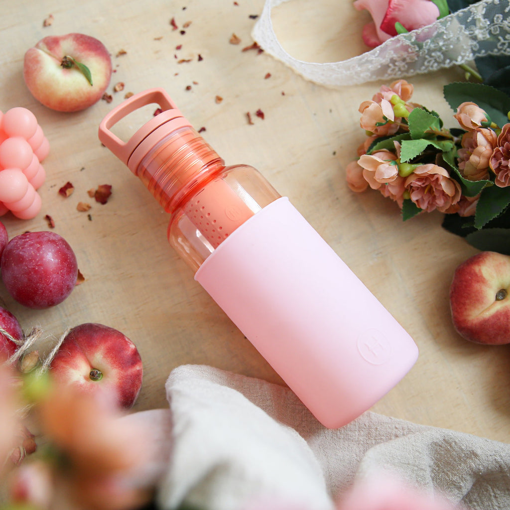 HYDY Peachy orange cherry blossoms 20 oz bottle with vibrant floral design and clear plastic body.