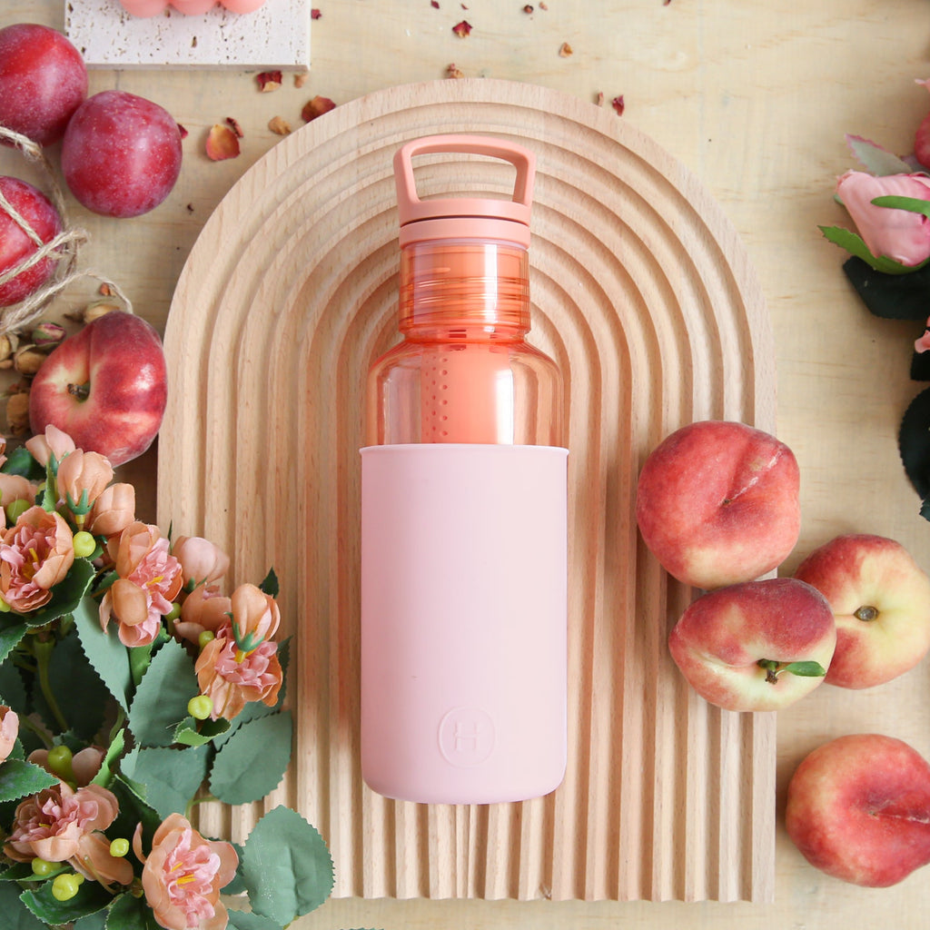 Hydy Peachy Orange Cherry Blossoms 20 oz bottle with vibrant cherry blossom design and clear view of the beverage inside.