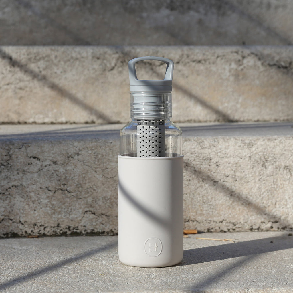 HYDY Clear-Cloudy Grey 20 oz bottle showing a sleek, transparent grey plastic container with a secure lid.