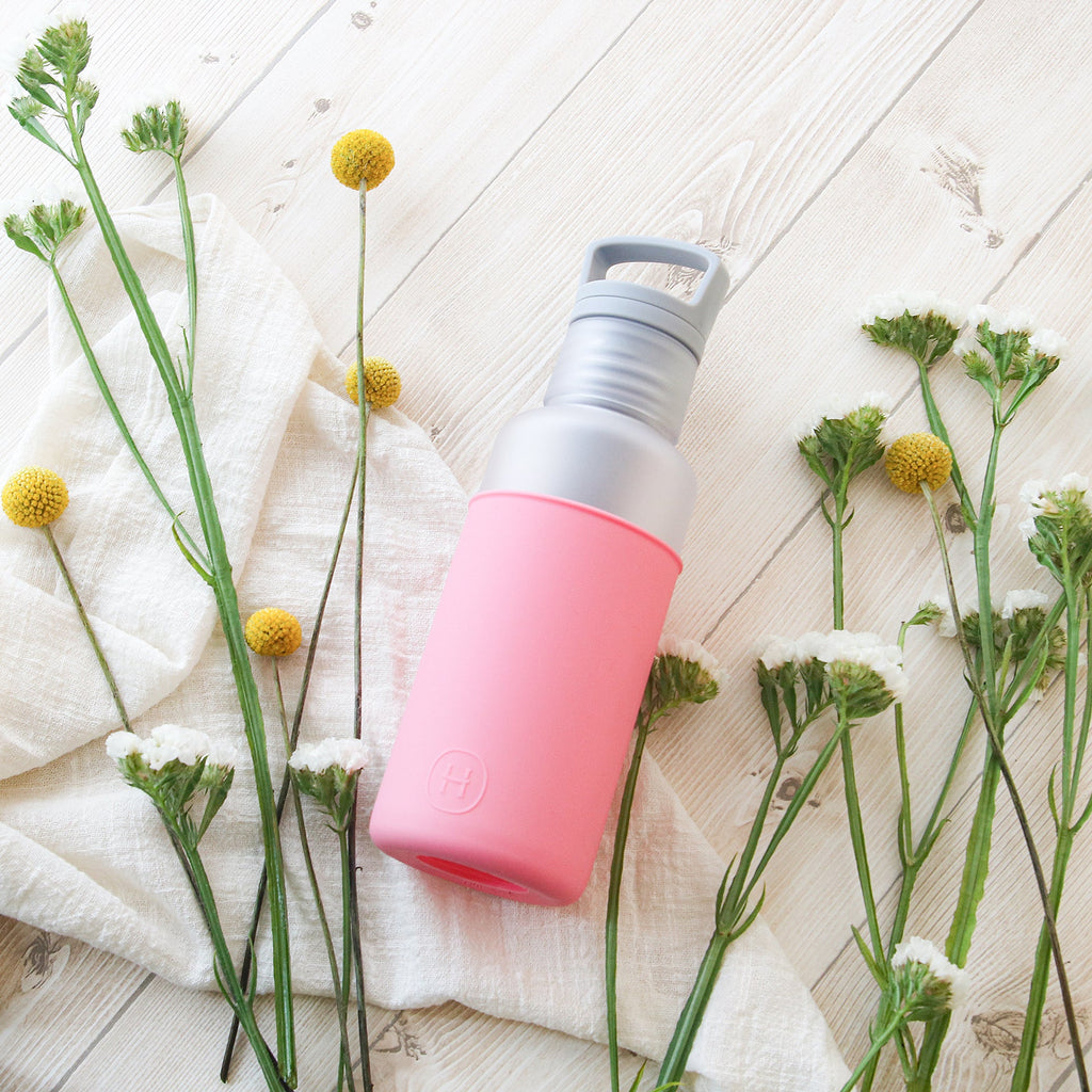 HYDY Misty-Rose Pink 20 oz bottle with a sleek design and transparent body, showcasing its vibrant pink color.
