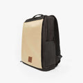 Beige DRiiBE CITYC 2-in-1 travel backpack with side view, featuring multiple compartments and adjustable straps.