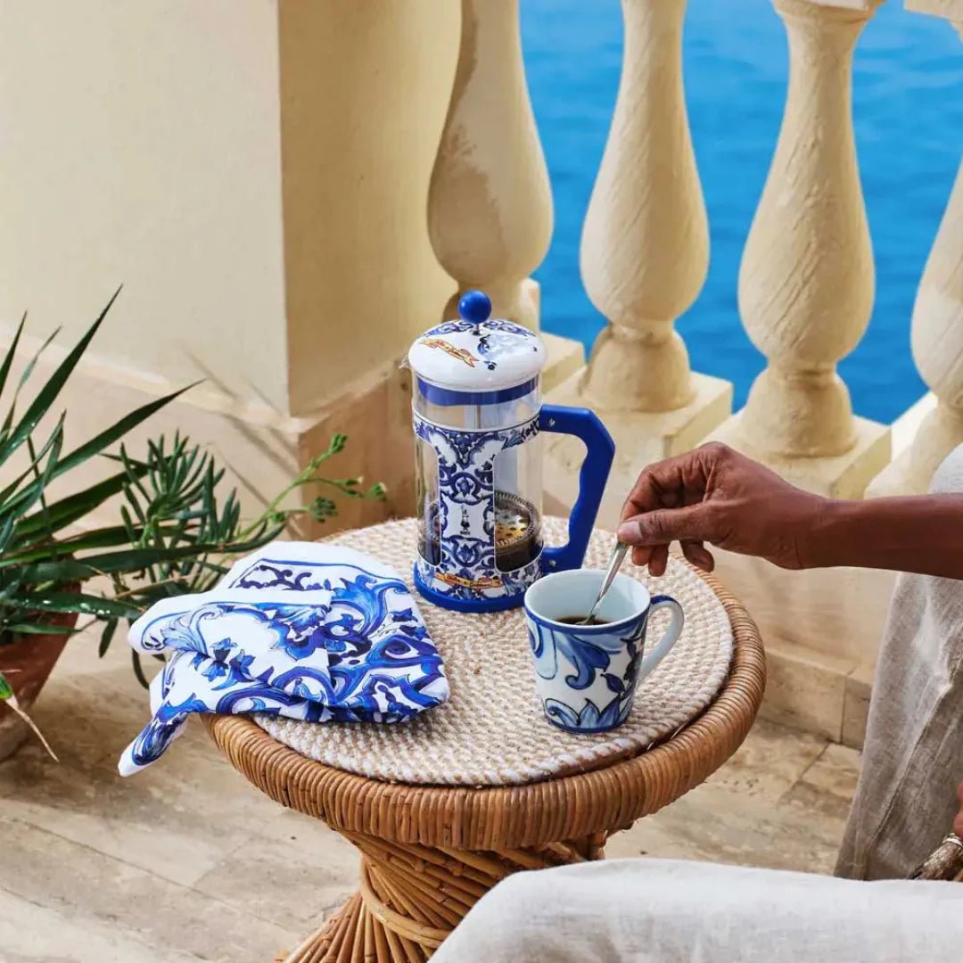 Blue Bialetti X Dolce&Gabbana Mediterranean French press coffee maker by Brew Italia, 8-cup capacity with elegant design.