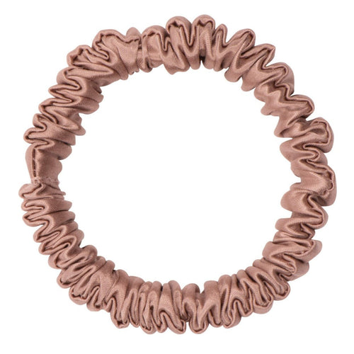 Bronze silk scrunchie by DREAMSILK, skinny style, made of smooth, shiny silk fabric, shown coiled on a white background.