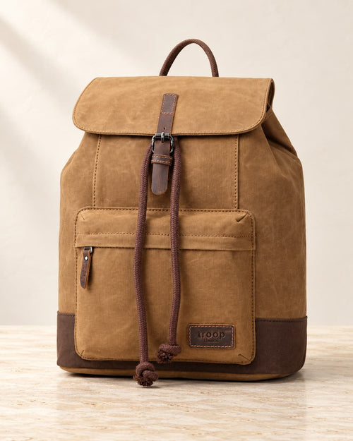 Camel Troop London Heritage Waxed Canvas Laptop Backpack in warm ivory, showing sturdy straps and spacious interior.