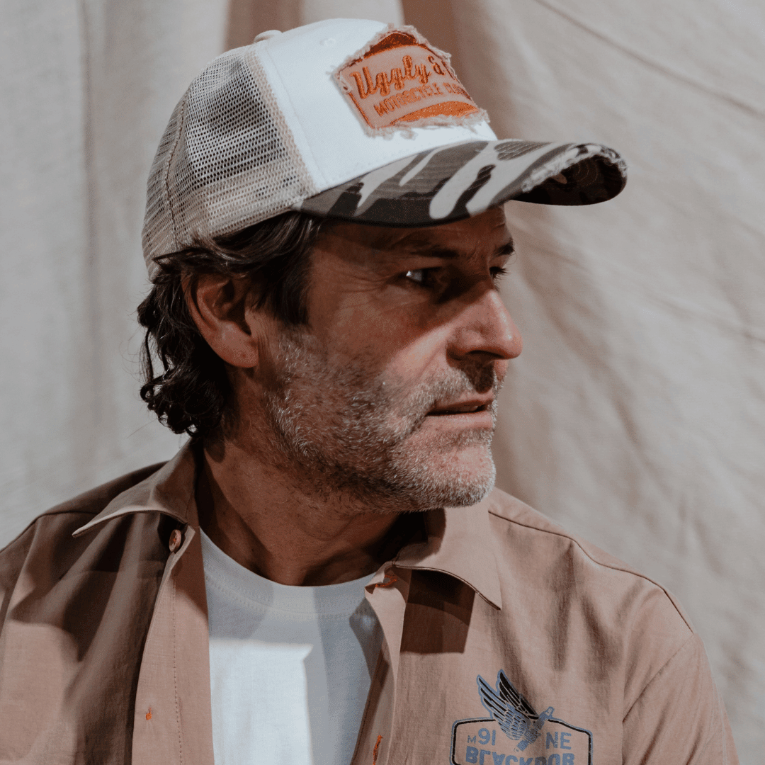 Camo diamond trucker hat by Uggly and Co featuring a mesh back and adjustable snap closure for casual outdoor wear.