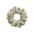 Champagne silk scrunchie by DREAMSILK, a soft and shiny hair accessory made from luxurious silk fabric.