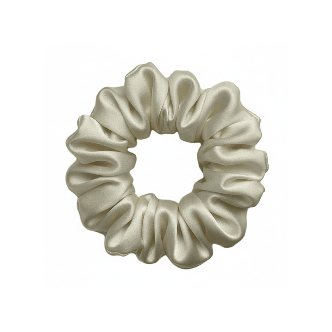 Champagne silk scrunchie by DREAMSILK, a soft and shiny hair accessory made from luxurious silk fabric.