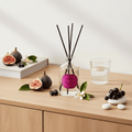 Reed diffuser by Parks Candles featuring wild fig, cassis, and orange blossom scent in a 220ml bottle with reeds.