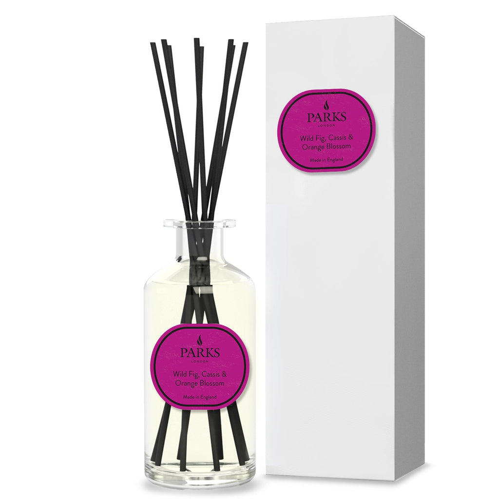 Reed diffuser from Parks Candles in a 220ml bottle with wild fig, cassis, and orange blossom fragrance, featuring reed sticks.