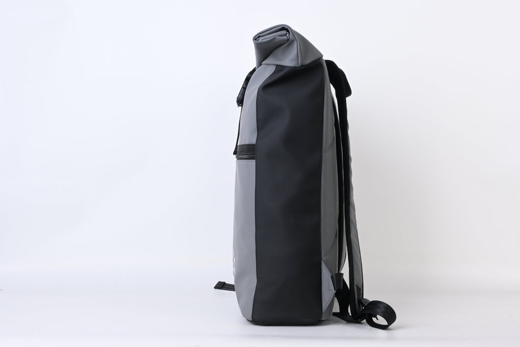 North Peak Blaze Backpack with multiple compartments and padded straps, shown on a model in an outdoor setting.