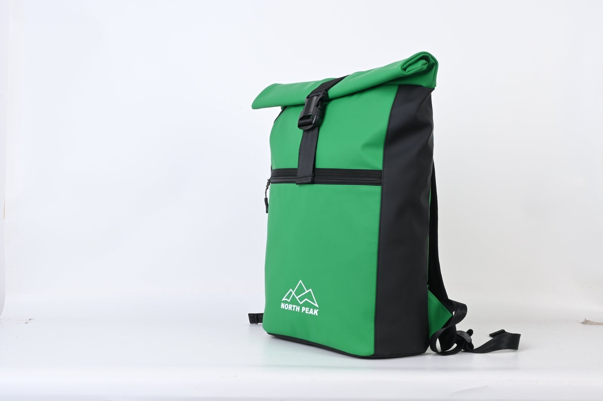 North Peak Blaze Backpack with multiple compartments and padded straps, shown on a person outdoors.