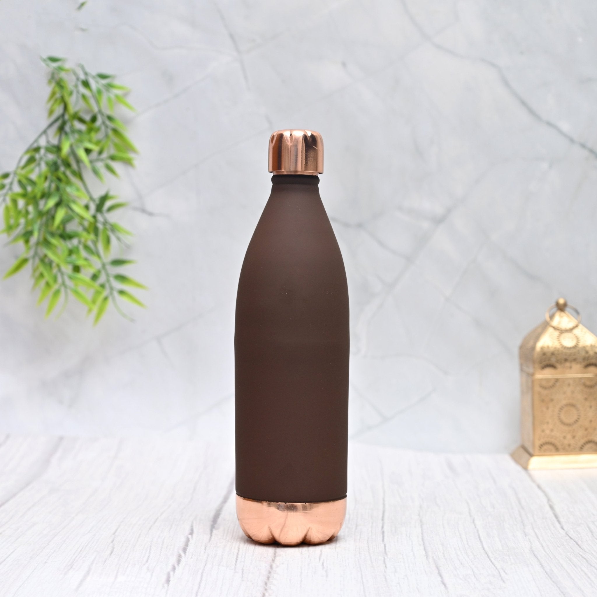 Pure copper Atlas Silk bottle in brown color, 1000 ML capacity, by SAMA Homes, showcasing its sleek, polished design and rounded shape.