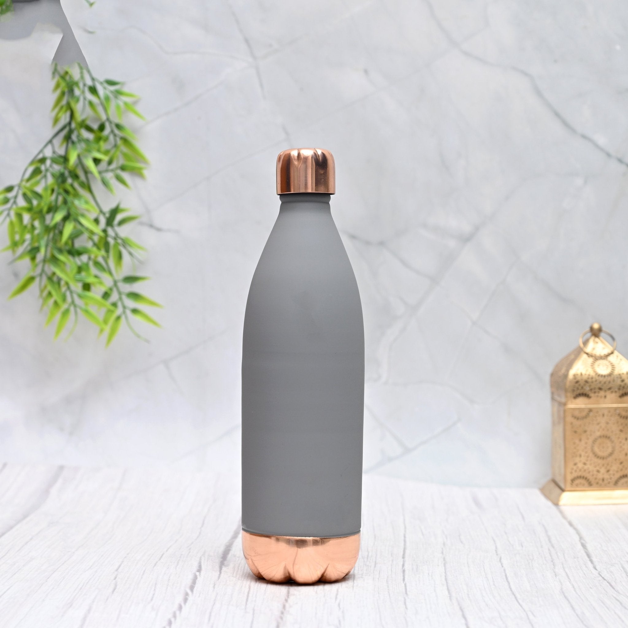 Pure copper Atlas Silk bottle in grey, 1000 ML capacity, by SAMA Homes, showcasing a sleek, polished copper water bottle.