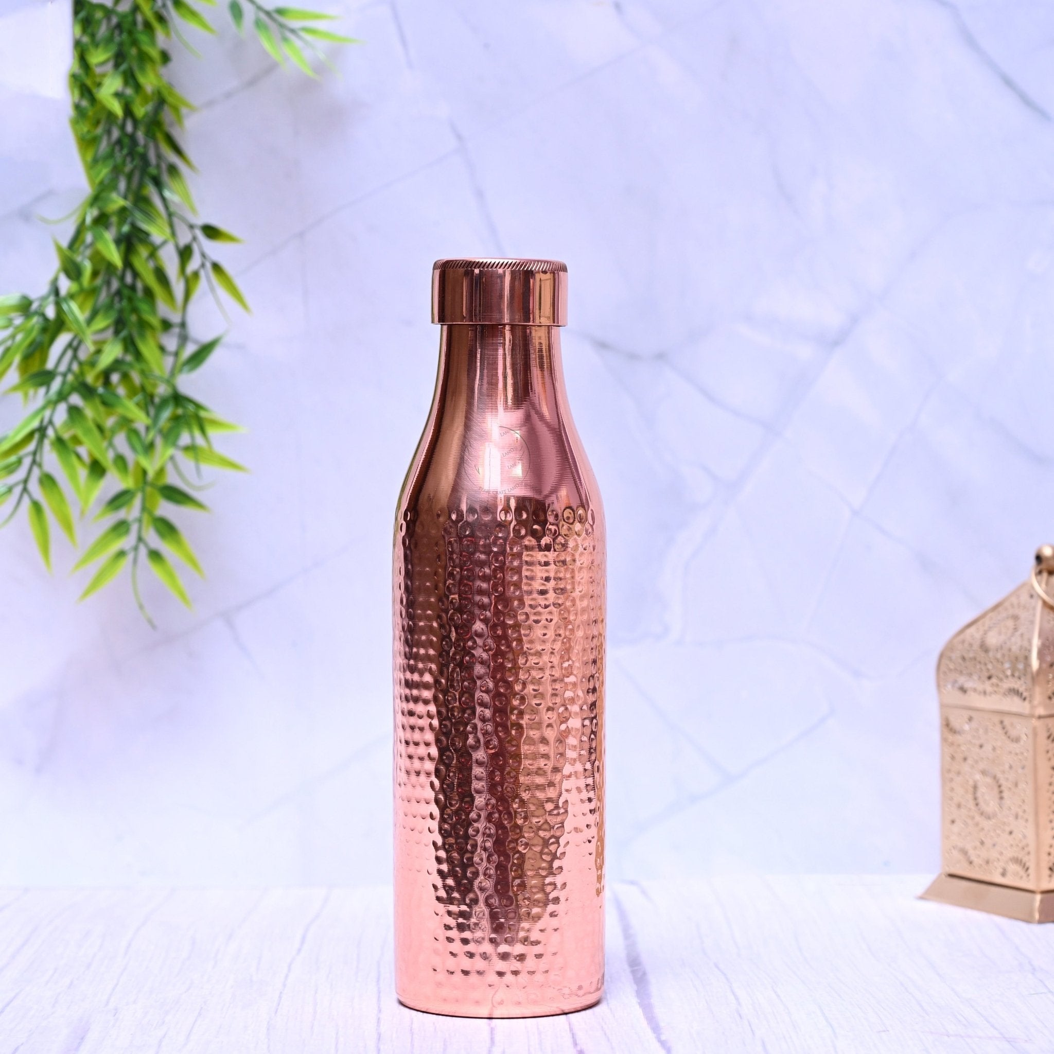 Pure copper water bottle with hammered design, 1000ml capacity, by SAMA Homes, featuring a plain, unique copper bottle style.