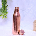 Pure copper water bottle with hammered design, 1000ml capacity, by SAMA Homes, featuring a sleek, plain finish.