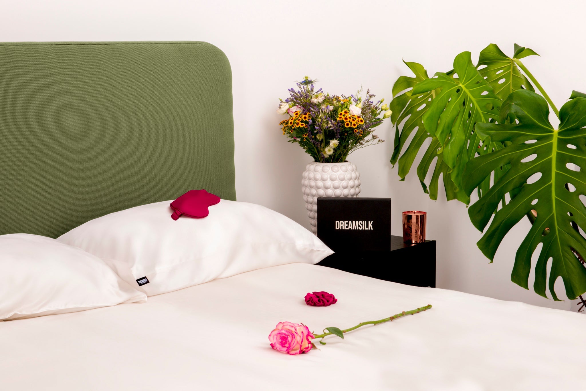 White silk pillowcase from DREAMSILK, standard size, smooth and luxurious fabric with a soft, shiny finish.