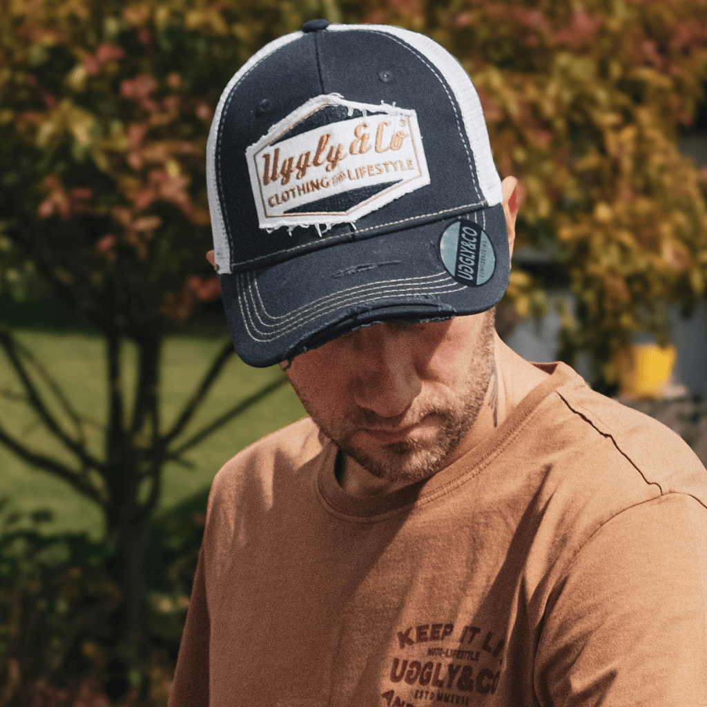 Night blue and gold diamond trucker cap by Uggly and Co, featuring a stylish design with mesh back and curved brim.
