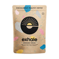Organic decaf coffee by Exhale Healthy Coffee in a white background, showcasing a fresh, brewed coffee cup and coffee beans.