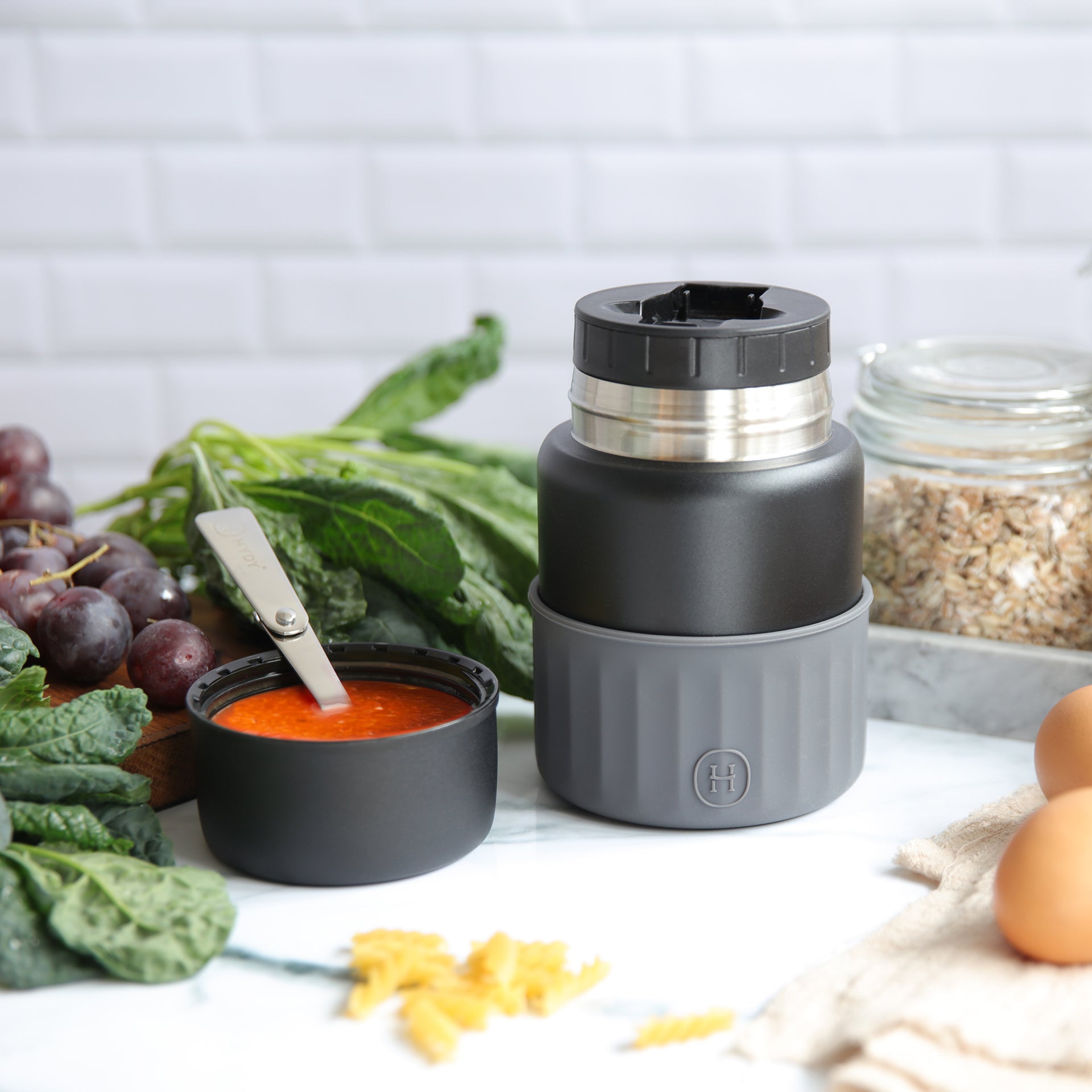 Black metallic grey HYDY food jar, 20 fl oz, with a sleek, insulated design ideal for storing hot or cold meals.