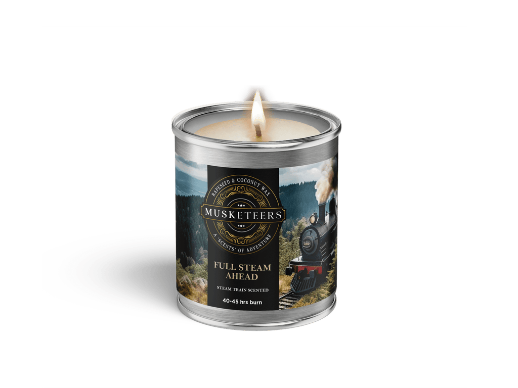 Musketeers Full Steam Ahead steam train scented masculine candle with lid, featuring a vintage train design on the container.