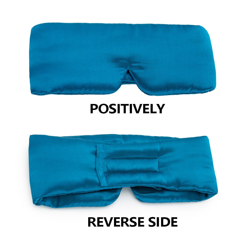 Black silk sleep mask by DREAMSILK, soft and luxurious for complete blackout and comfortable sleep.