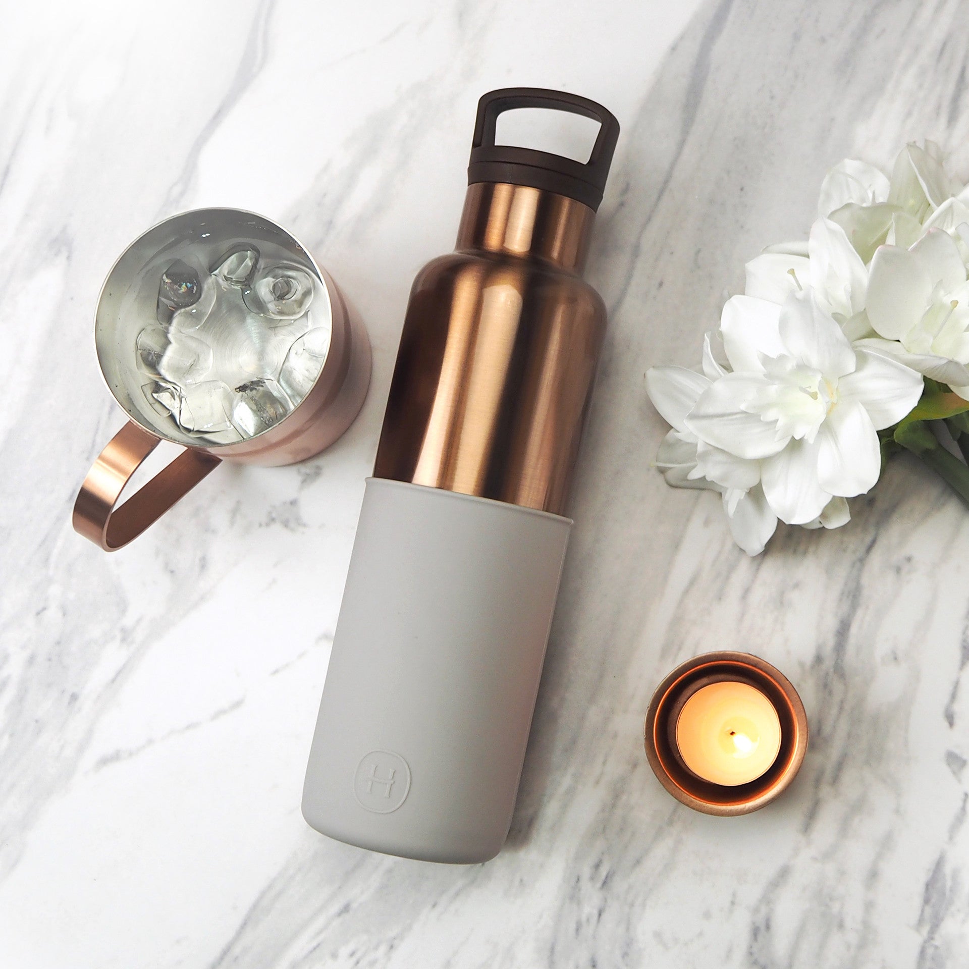 HYDY 20 oz bronze gold and cloudy grey bottle with a sleek, modern design, perfect for stylish hydration.