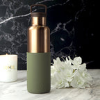 HYDY bronze gold-seaweed green 20 oz bottle, featuring a sleek glass design with a bronze gold and seaweed green finish.