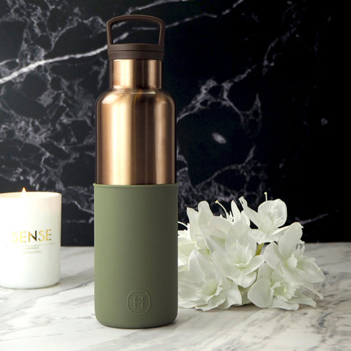 HYDY bronze gold-seaweed green 20 oz bottle, featuring a sleek glass design with a bronze gold and seaweed green finish.