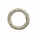 DREAMSILK champagne-colored silk scrunchie, skinny style, with smooth, shiny silk fabric for gentle hair hold and elegant look.