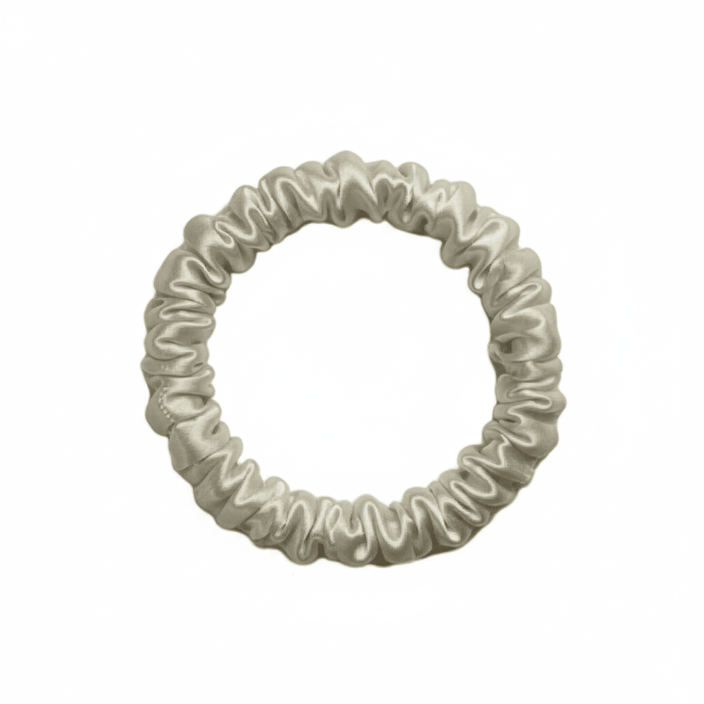 DREAMSILK champagne-colored silk scrunchie, skinny style, with smooth, shiny silk fabric for gentle hair hold and elegant look.
