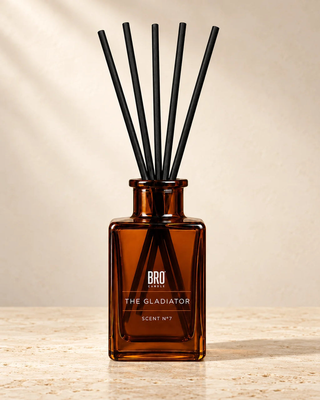 Bro Candle Gladiator reed diffuser with amber-colored reeds and glass bottle, designed for home fragrance.