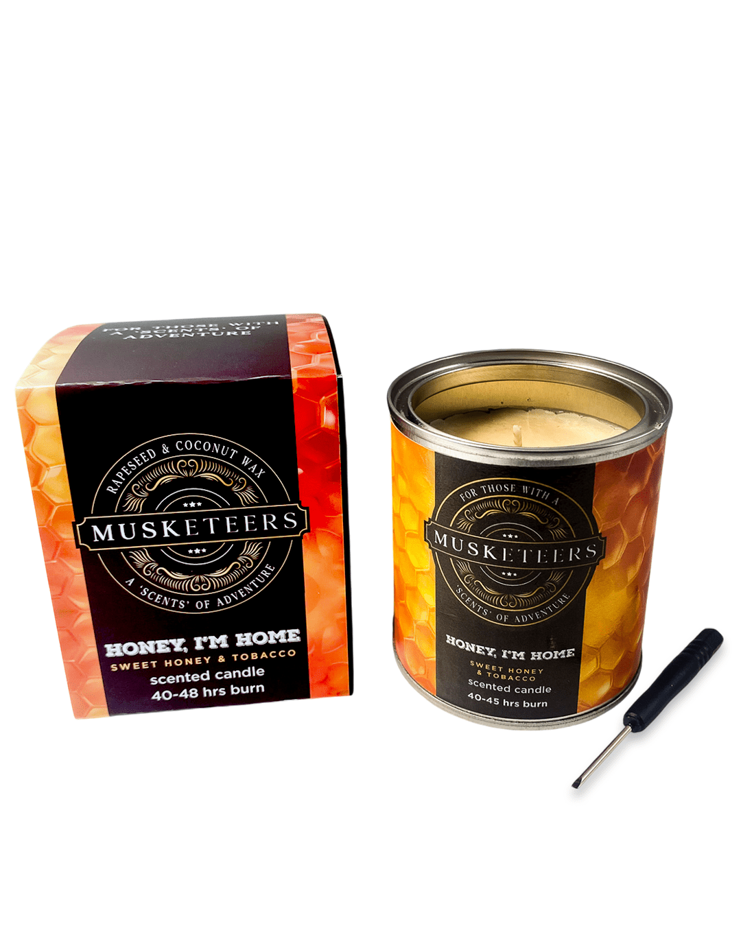 Musketeers Honey I'm Home candle with honey and tobacco scent, featuring a warm, decorative candle design in a glass jar.