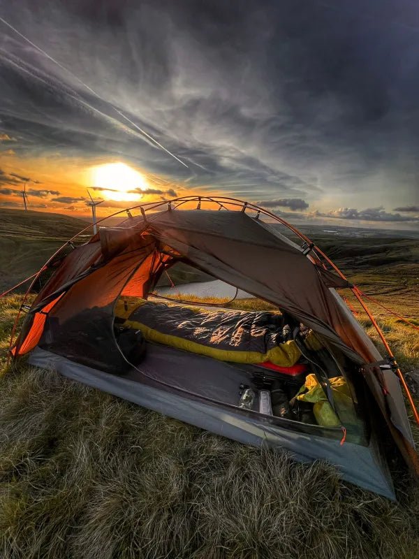 HikeWare Night Cat 2-person backpacking tent with aluminum poles set up outdoors, showing the tent's waterproof fabric and ventilation.