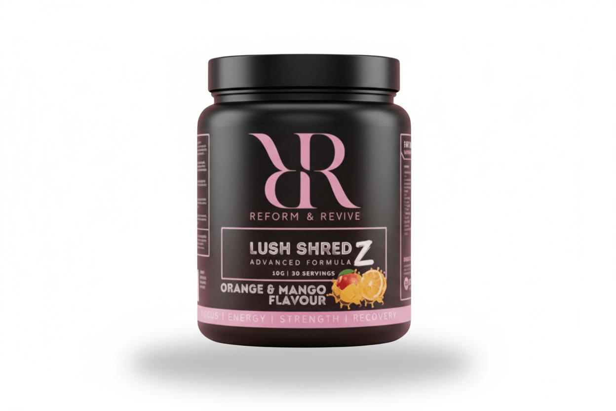 Reform and Revive Lush Shredz Women's Metabolism Support supplement bottle with two capsules and fresh green leaves.