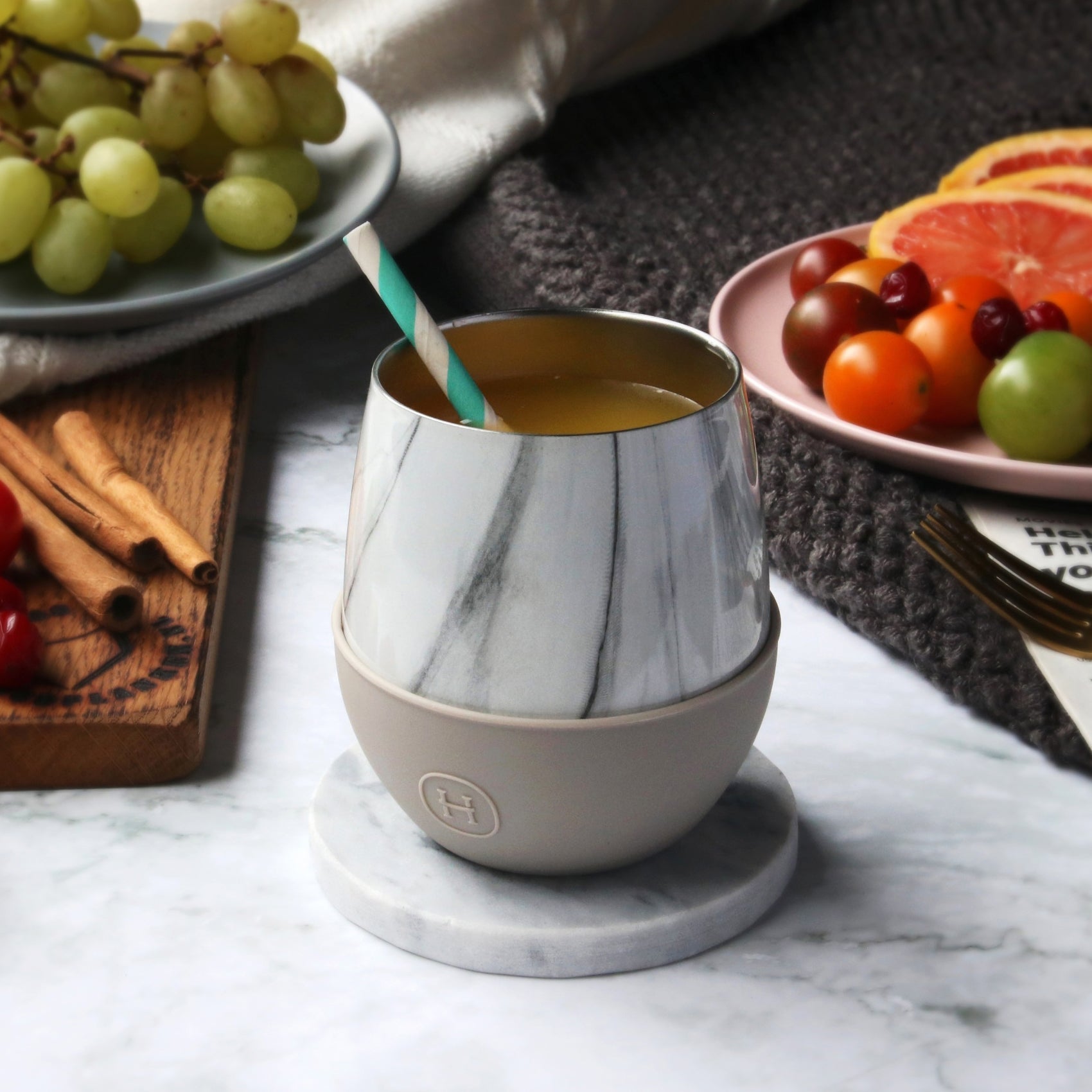 White marble HYDY eucalyptus 8 oz tumbler with a sleek design and secure lid, perfect for on-the-go beverages.
