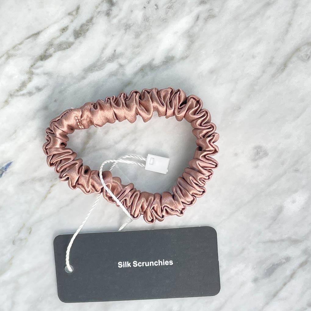 DREAMSILK bronze silk scrunchie, skinny style, soft and shiny silk fabric, ideal for hair styling and accessories.